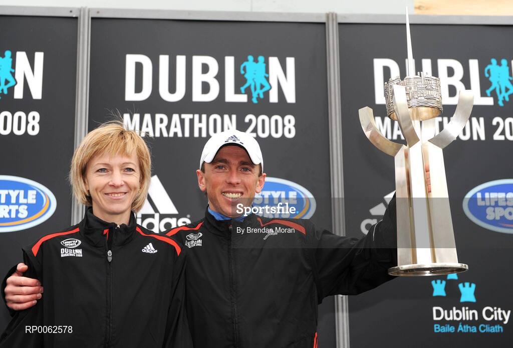 27 October 2008; The winners of the women's and men's races, Larissa Zousko, left, of the Russia and Andriy Naumov, of the Ukraine, with the Noel Carroll perpetual trophy during the Lifestyle Sports - adidas Dublin Marathon 2008. Merrion Square, Dublin. Picture credit: Brendan Moran / SPORTSFILE