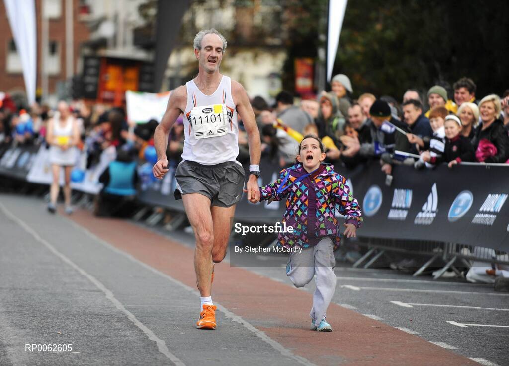 27 October 2008; Neil O'Connell, from Limerick, on his way to crossing the line with his daughter Iseult, age 7, during the Lifestyle Sports - adidas Dublin Marathon 2008. Merrion Square, Dublin. Picture credit: Stephen McCarthy / SPORTSFILE
