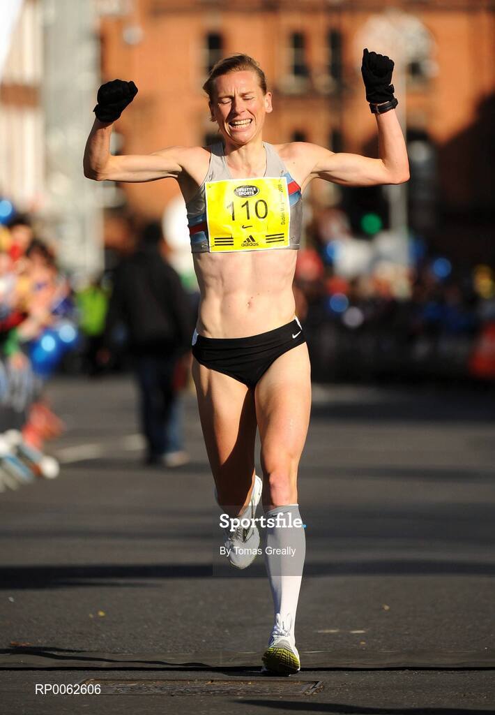 27 October 2008; Maria McCambridge, Dundrum South Dublin AC, celebrates coming home as the first Irish woman and National Marathon Champion 2008 during the Lifestyle Sports - adidas Dublin Marathon 2008. Merrion Square, Dublin. Picture credit: Tomas Greally / SPORTSFILE