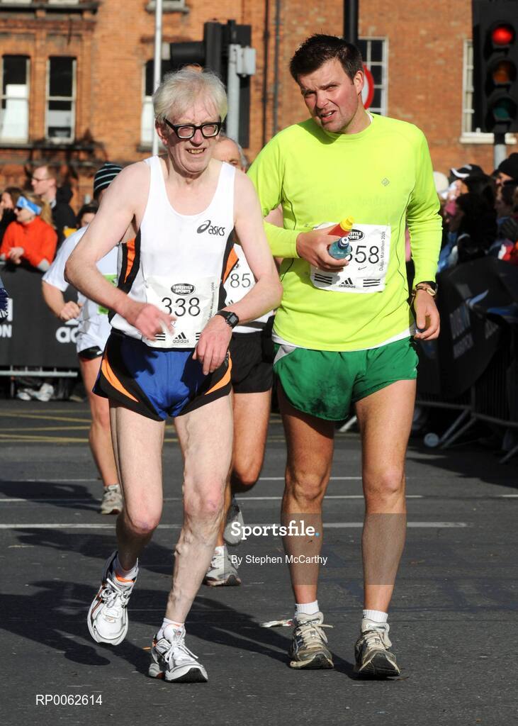 27 October 2008; Billy Harpur, from Wexford, is urged on by Jason Kenny, from Wexford, on the approach to the finish of the the Lifestyle Sports - adidas Dublin Marathon 2008. Merrion Square, Dublin. Picture credit: Stephen McCarthy / SPORTSFILE