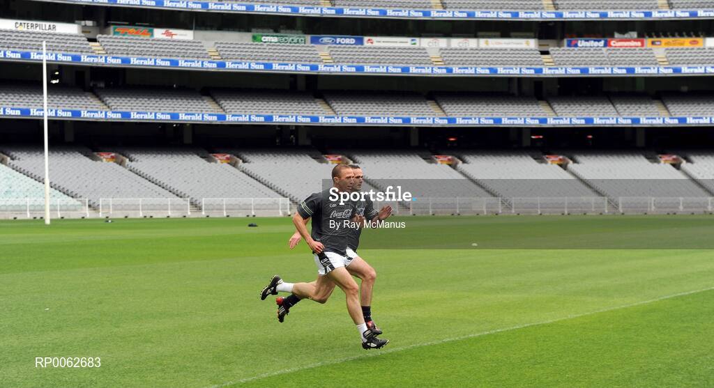 28 October 2008; John Keane, Westmeath, who took little part in the session, runs the pitch with Irish 'runner' Sean Marty Lockhard during an Ireland International Rules training session. 2008 International Rules tour, Melbourne Cricket Ground, Melbourne, Auatralia. Picture credit: Ray McManus / SPORTSFILE