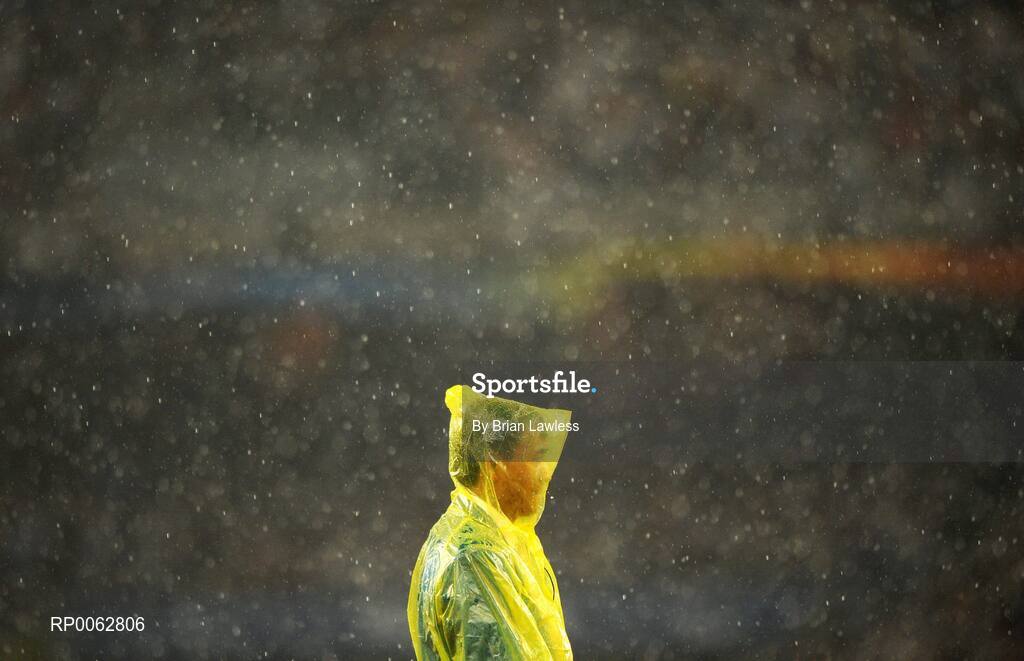 16 September 2008; A volunteer during a heavy rain shower. Beijing Paralympic Games 2008, National Stadium, Olympic Green, Beijing, China. Picture credit: Brian Lawless / SPORTSFILE