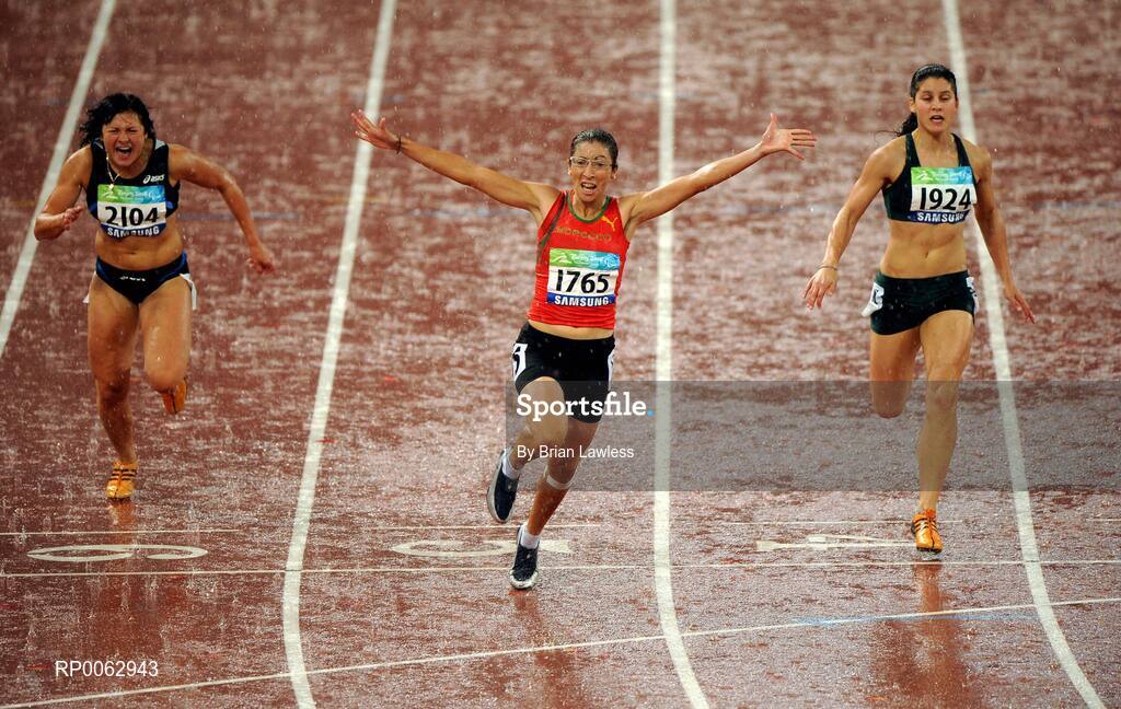 16 September 2008; Morocco's Sanaa Benhama, centre, on celebrates winning the Women's 100m - T13 final in a world record time of 12.28 ahead of 5th place Maryna Chyshko of Ukraine, left, and 2nd place Ilse Hayse of South Africa. Beijing Paralympic Games 2008, Women's 100m - T13 Final, National Stadium, Olympic Green, Beijing, China. Picture credit: Brian Lawless / SPORTSFILE