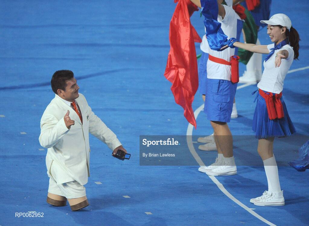 6 September 2008; Mexico's shot putter Enrique Sanchez is welcomed by a volunteer during the Opening Ceremony of the Beijing Paralympic Games 2008, National Stadium, Olympic Green, Beijing, China. Picture credit: Brian Lawless / SPORTSFILE