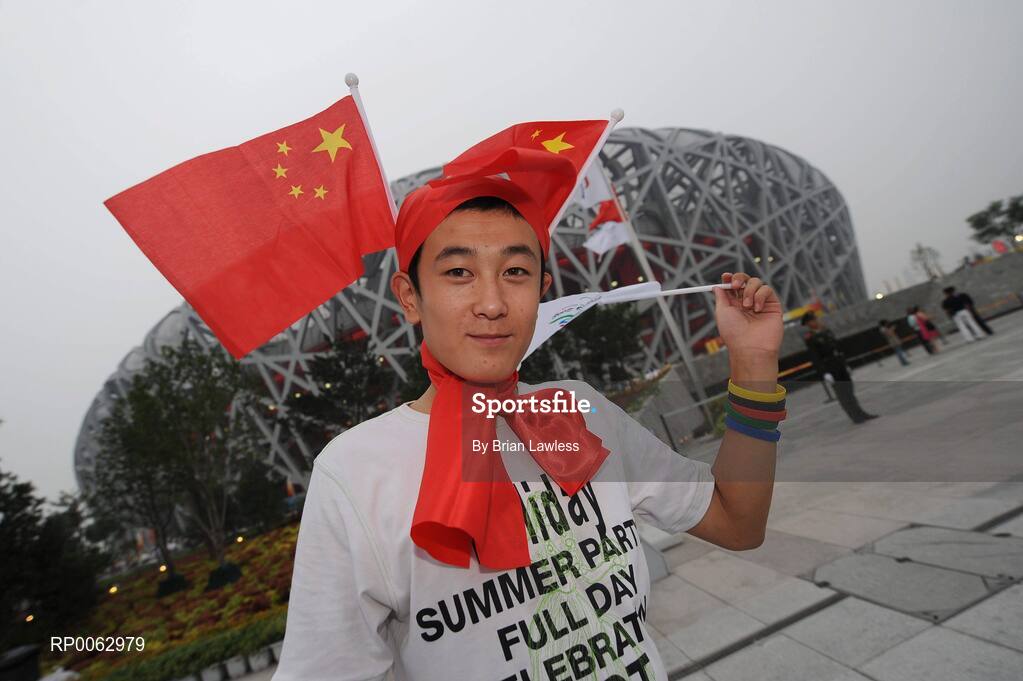 6 September 2008; A chinese fan outside the 'Bird's Nest' before the Opening Ceremony of the Beijing Paralympic Games 2008, National Stadium, Olympic Green, Beijing, China. Picture credit: Brian Lawless / SPORTSFILE