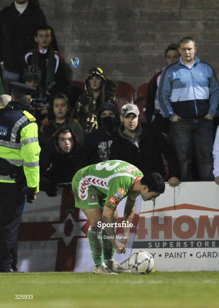 1 November 2008; A bottle is thrown from the Glentoran section of supporters at Danny Murphy, Cork City, during the closing stages of the game. Setanta Sports Cup Final, Cork City v Glentoran, Turners Cross, Cork. Picture credit: David Maher / SPORTSFILE