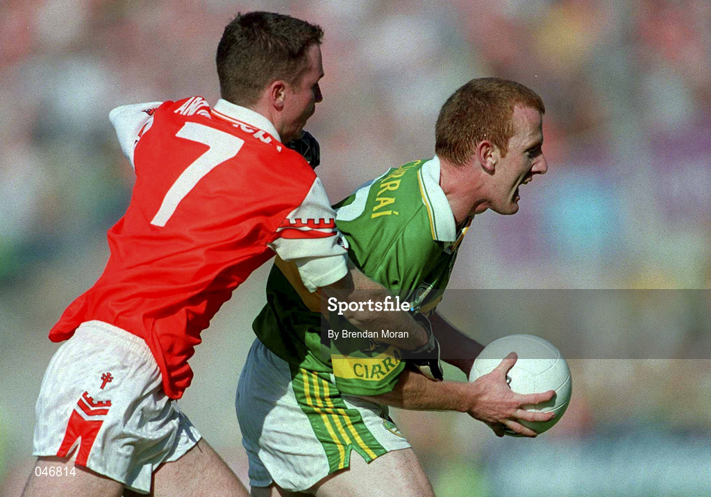 2 September 2000; Liam Hassett of Kerry is tackled by Andrew McCann of Armagh during the Bank of Ireland All-Ireland Senior Football Championship Semi-Final Replay match between Kerry and Armagh at Croke Park in Dublin. Photo by Brendan Moran/Sportsfile