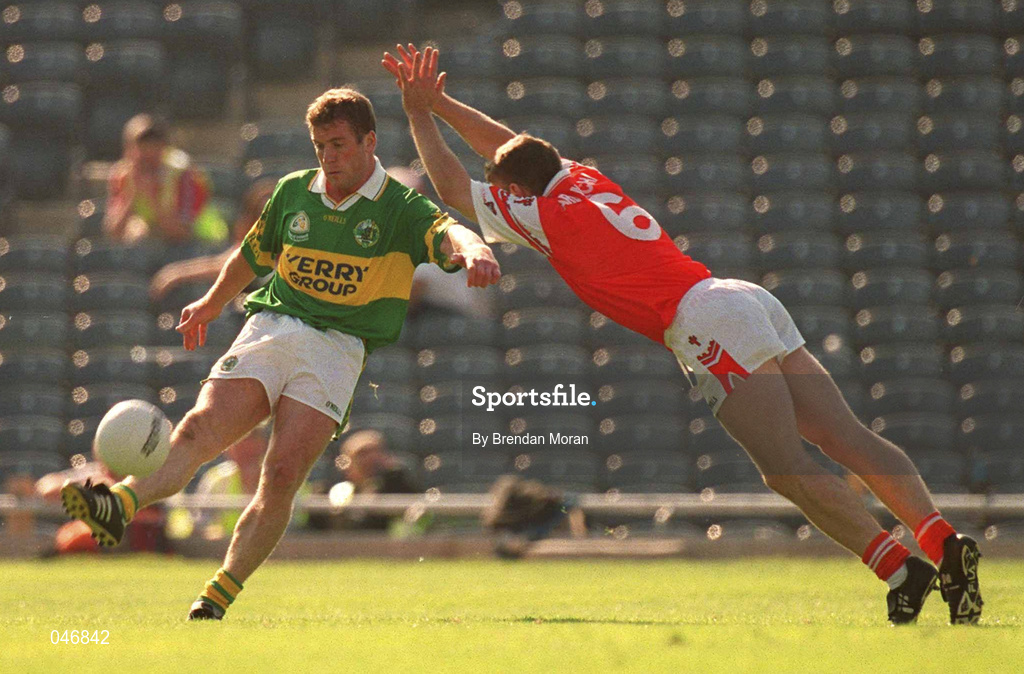 2 September 2000; Dara O'Cinneide, of kerry is blocked down by Kieran McGeeney of Armagh during the Bank of Ireland All-Ireland Senior Football Championship Semi-Final Replay match between Kerry and Armagh at Croke Park in Dublin. Photo by Brendan Moran/Sportsfile
