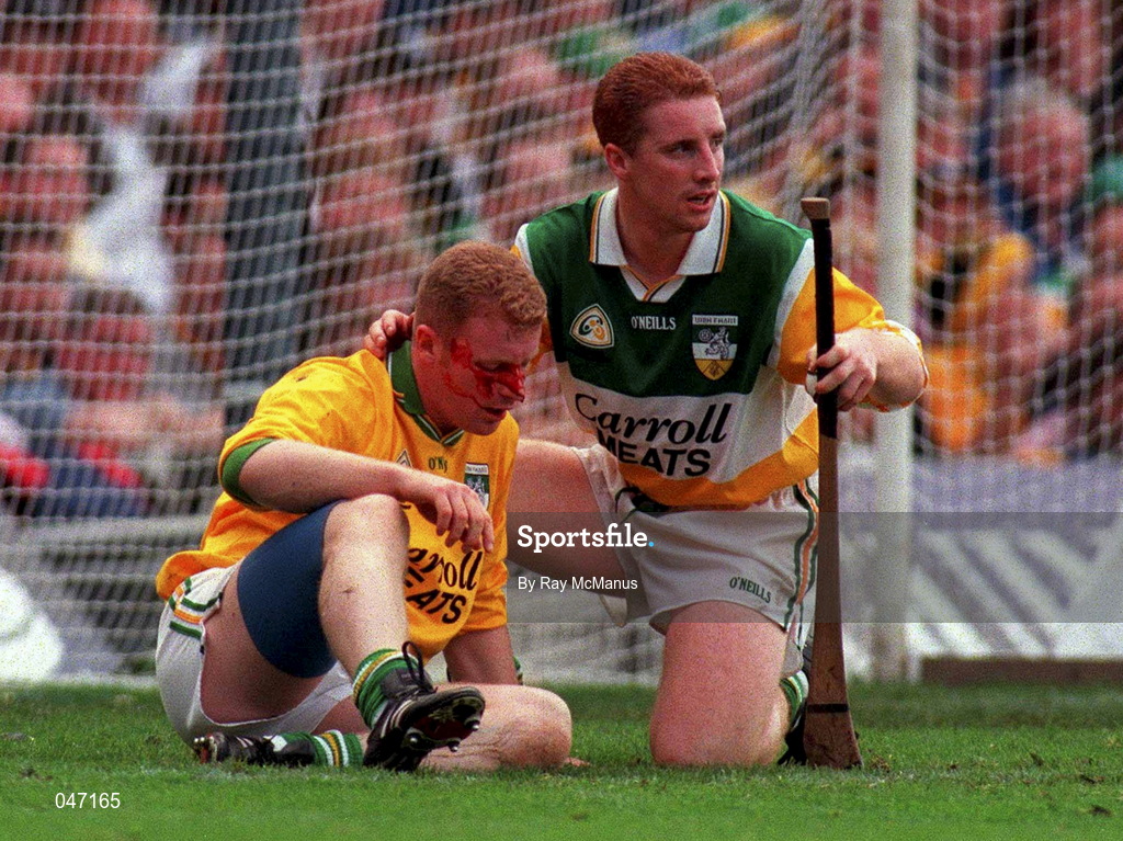 10 September 2000; Simon Whelahan of Offaly assist his team-mate Stephen Byrne after he was injured when Kilkenny's Henry Shefflin scored a goal during the All-Ireland Senior Hurling Championship Final match between Kilkenny and Offaly at Croke Park in Dublin. Photo by Ray McManus/Sportsfile