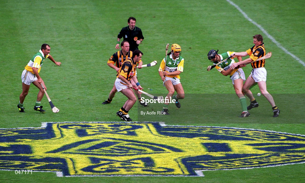 10 September 2000; Players From left, Johnny Dooley of Offaly, Brian McEvoy and Andy Comerford of Kilkenny, Ger Oakley, yellow helmet, of Offaly, Gary Hanniffy of Offaly and Eamon Kennedy of Kilkenny during the All-Ireland Senior Hurling Championship Final match between Kilkenny and Offaly at Croke Park in Dublin. Photo by Aoife Rice/Sportsfile