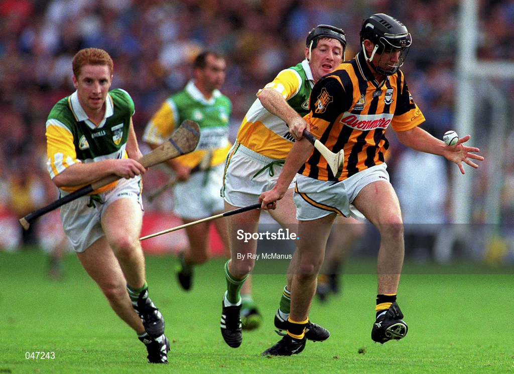 10 September 2000; John Hoyne of Kilkenny is tackled by Brian Whelahan of Offaly during the All-Ireland Senior Hurling Championship Final match between Kilkenny and Offaly at Croke Park in Dublin. Photo by Ray McManus/Sportsfile