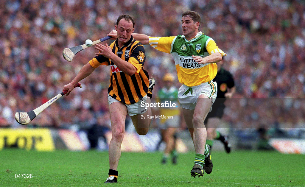 10 September 2000; Andy Comerford of Kilkenny is tackled by Michael Duignan of Offaly during the All-Ireland Senior Hurling Championship Final match between Kilkenny and Offaly at Croke Park in Dublin. Photo by Ray McManus/Sportsfile