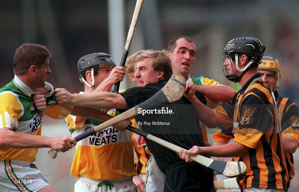 10 September 2000; Linesman, Michael Wadding, intervenes between Offaly players Michael Duignan, Joe Errity, Johnny Dooley and John Hoyne of Kilkenny during the All-Ireland Senior Hurling Championship Final match between Kilkenny and Offaly at Croke Park in Dublin. Photo by Ray McManus/Sportsfile