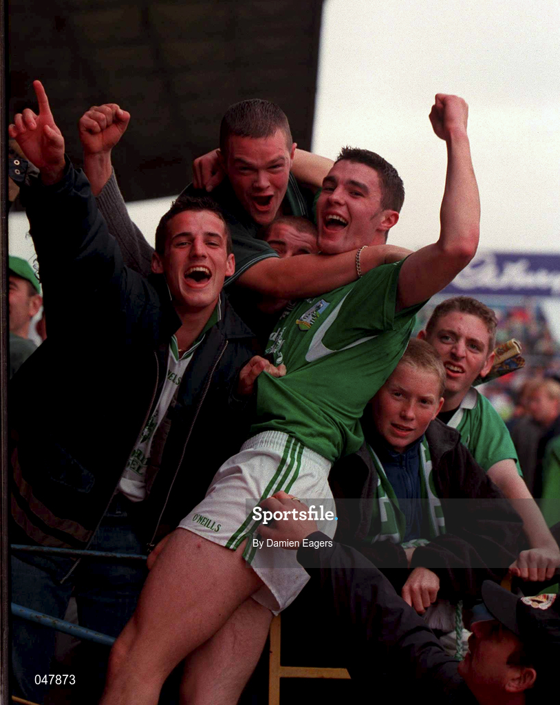 17 September 2000; Limerick's Stephen Lucey celebrates with fans after the final whistle following the All Ireland Under-21 Hurling Championship Final match between Galway and Limerick at Semple Stadium in Thurles, Tipperary. Photo by Damien Eagers/Sportsfile