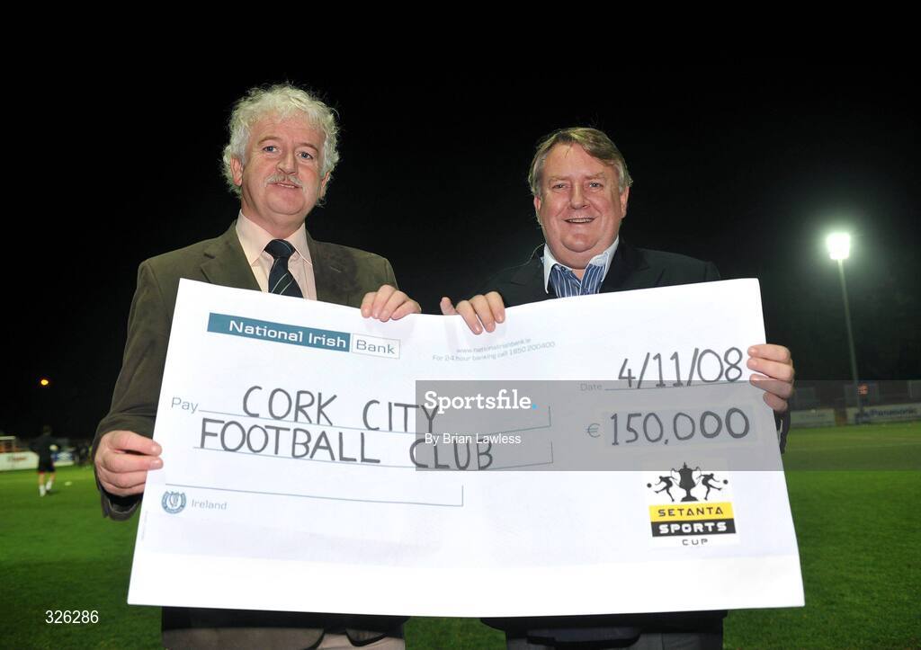 4 November 2008; General Manager of Cork City FC Gerry Nagle, right, is presented with a cheque for €150,000 by Chairman of the Setanta Sports Cup Organising Commitee Milo Corcoran for their cup final win. eircom League of Ireland Premier Division, St. Patrick's Athletic v Cork City, Richmond Park, Dublin. Picture credit: Brian Lawless / SPORTSFILE