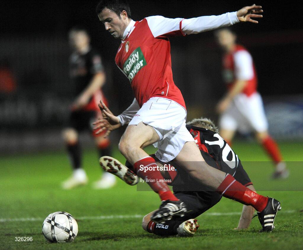 4 November 2008; Keith Fahy, St. Patrick’s Athletic, is tackled by Liam Kearney, Cork City. eircom League of Ireland Premier Division, St. Patrick’s Athletic v Cork City, Richmond Park, Dublin. Picture credit: Brian Lawless / SPORTSFILE