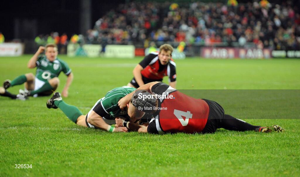 8 November 2008; Ireland's Keith Earls goes over for the first try of the game despite the tackle of Canada's Mike Burak. Guinness Autumn Internationals, Ireland v Canada, Thomond Park, Limerick. Picture credit: Matt Browne / SPORTSFILE