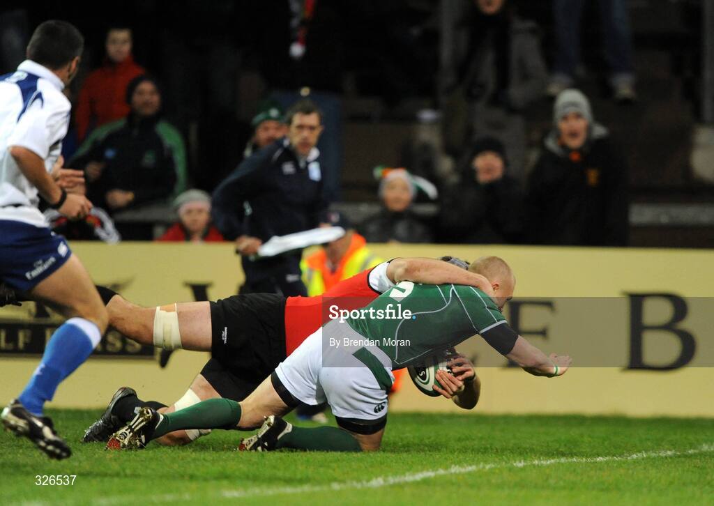 8 November 2008; Ireland's Keith Earls goes over for the first try of the game despite the tackle of Canada's Michael Burak. Guinness Autumn Internationals, Ireland v Canada, Thomond Park, Limerick. Picture credit: Brendan Moran / SPORTSFILE