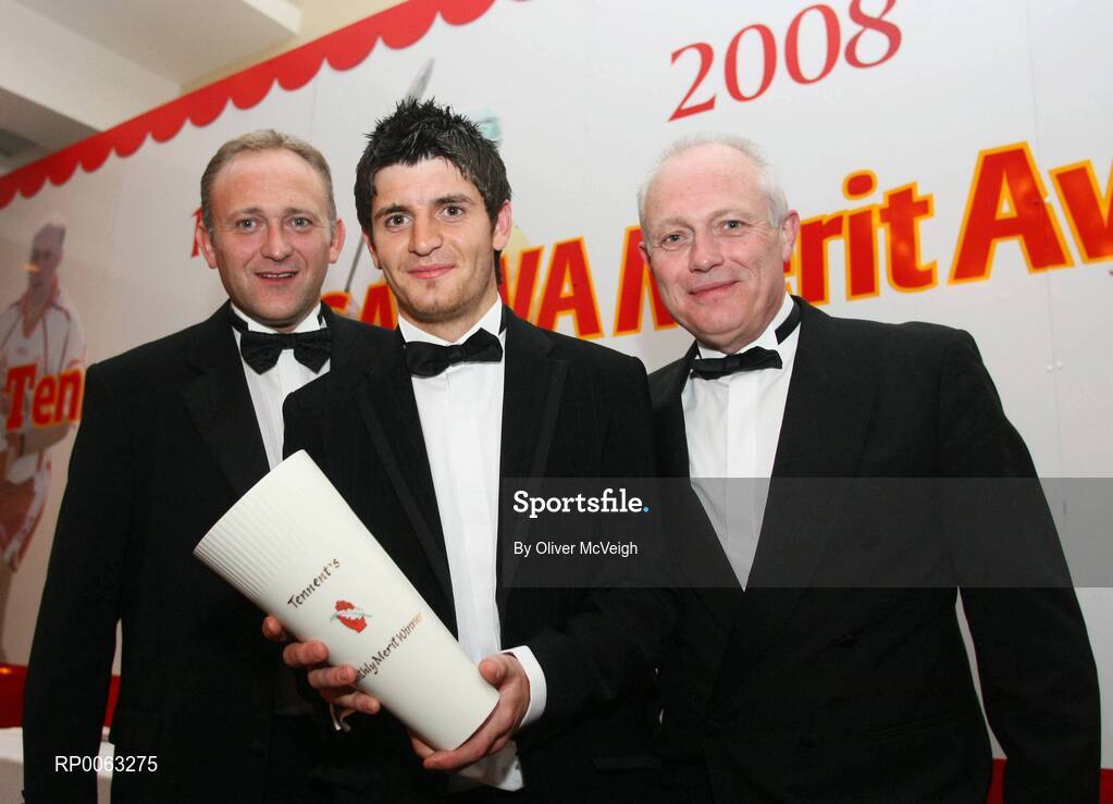 1 November 2008; Cushendall Ruairi Og's hurler Shane McNaughton, centre, is presented with the October Tennent’s/Ulster GAA Writers’ Award by Jeff Tosh, Sales Director, Inbev Ireland, left, and Tom McCusker, Managing Director, Inbev Ireland, at the Ulster GAA Writers’ banquet in the The Hillgrove Hotel, Leisure & Spa, Monaghan. Shane has been in the Cushendall senior panel since the age of 15 and has been three years in the Antrim senior squad. To date, he has won two Ulster and three Antrim senior medals plus three Ulster Minor awards and a Walsh Cup medal. The Hillgrove Hotel, Leisure & Spa, Monaghan. Picture credit: Oliver McVeigh / SPORTSFILE