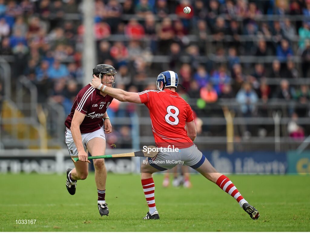26 July 2015; Joseph Cooney, Galway, has his helmet interfered with by Damien Cahalane, Cork, resulting in a second yellow card and subsequently a red card. GAA Hurling All-Ireland Senior Championship, Quarter-Final, Galway v Cork. Semple Stadium, Thurles, Co. Tipperary. Picture credit: Stephen McCarthy / SPORTSFILE