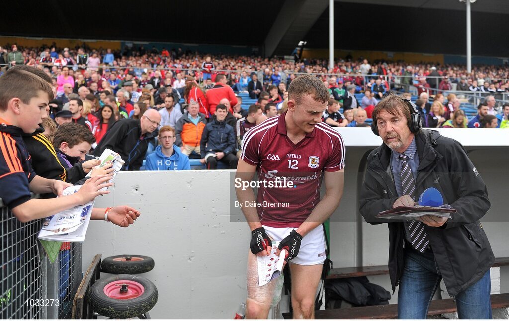 26 July 2015; Jonathan Glynn, Galway, signs autographs for supporters near the end of the game. GAA Hurling All-Ireland Senior Championship, Quarter-Final, Galway v Cork. Semple Stadium, Thurles, Co. Tipperary. Picture credit: Dáire Brennan / SPORTSFILE