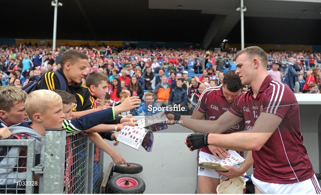 26 July 2015; Jonathan Glynn, right, and Iarla Tannian, Galway, sign autographs near the end of the game. GAA Hurling All-Ireland Senior Championship, Quarter-Final, Galway v Cork. Semple Stadium, Thurles, Co. Tipperary. Picture credit: Dáire Brennan / SPORTSFILE