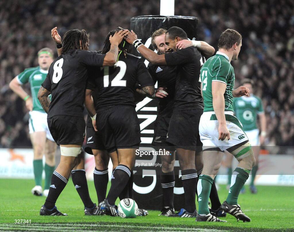 15 November 2008; New Zealand's Ma'a Nonu, 12, celebrates with team-mates Rodney So'oialo, left, and Joe Rokocoko, right, after scoring his side's first try as Ireland's Brian O'Driscoll looks on. Guinness Autumn Internationals, Ireland v New Zealand, Croke Park, Dublin. Picture credit: Pat Murphy / SPORTSFILE
