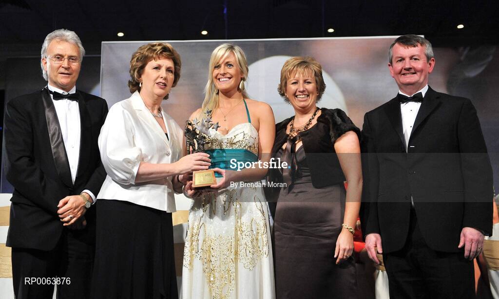 15 November 2008; Brid Stack of Cork, is presented with her All-Star award by President Mary McAleese, in the company of, from left, Tony Towell, O'Neills, Geraldine Giles, President, Cumann Peil na mBan and Pol O Gallchoir, Ceannsai, TG4. TG4 O'Neill's Ladies Football All-Stars Awards, Citywest Hotel, Dublin. Picture credit: Brendan Moran / SPORTSFILE