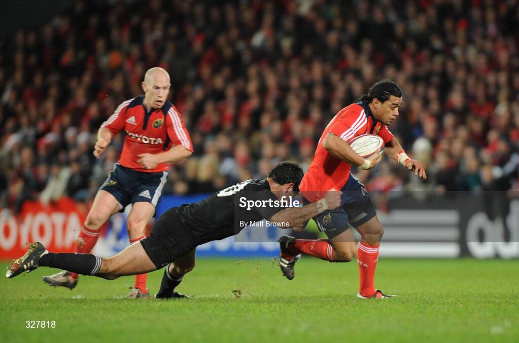 18 November 2008; Lifeimi Mafi, Munster, is tackled by Stephen Donald, New Zealand. Zurich Challenge Match, Munster v New Zealand, Thomond Park, Limerick. Picture credit: Matt Browne / SPORTSFILE