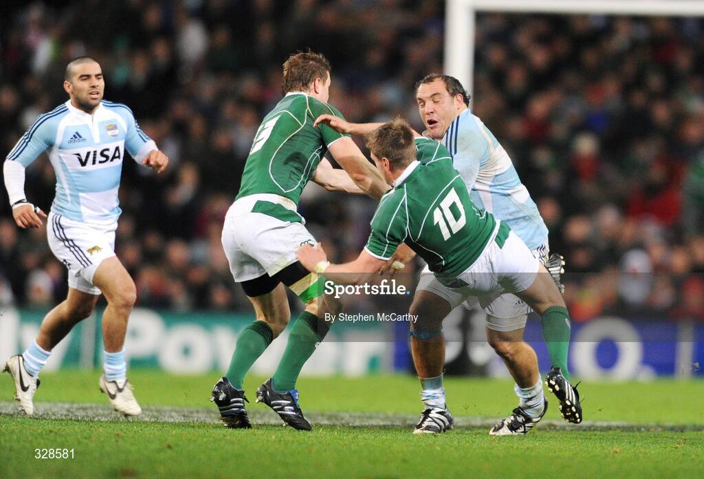 22 November 2008; Ronan O'Gara, Ireland, is knocked over by Rodrigo Roncero, Argentina. Guinness Autumn Internationals, Ireland v Argentina, Croke Park, Dublin. Picture credit: Stephen McCarthy / SPORTSFILE