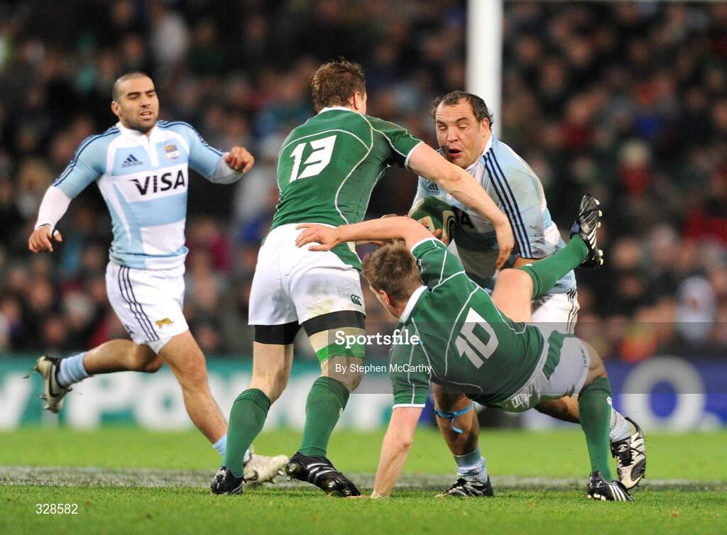 22 November 2008; Ronan O'Gara, Ireland, is knocked over by Rodrigo Roncero, Argentina. Guinness Autumn Internationals, Ireland v Argentina, Croke Park, Dublin. Picture credit: Stephen McCarthy / SPORTSFILE