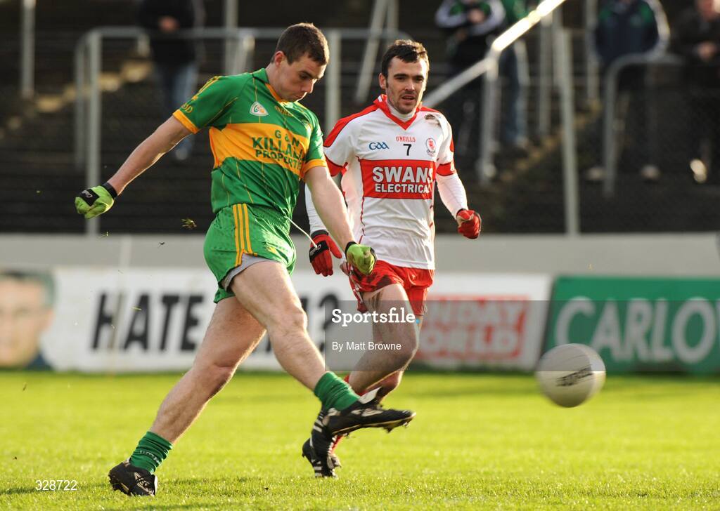 23 November 2008; Niall McNamee, Rhode, shoots to score the first goal of the game as Ber Hennessy, Eire Og, looks on. AIB Leinster Senior Club Football Championship Semi-Final, Eire Og v Rhode, Dr. Cullen Park, Carlow. Picture credit: Matt Browne / SPORTSFILE