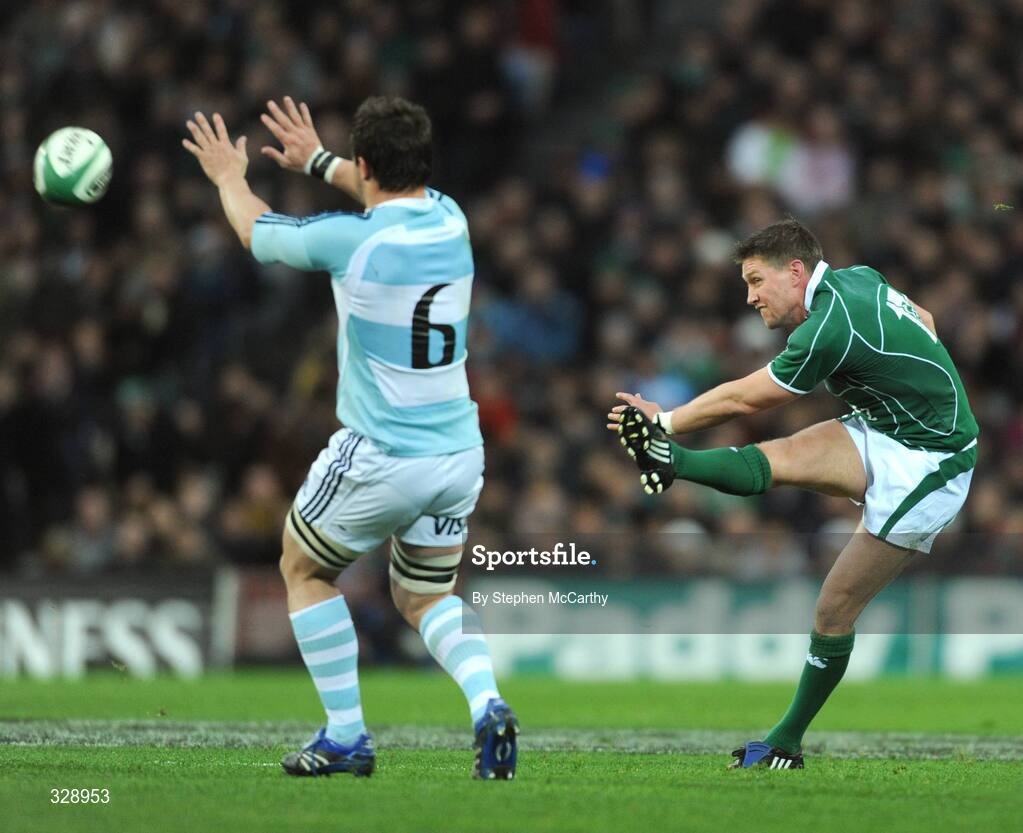 22 November 2008; Ronan O'Gara, Ireland, gets his kick away despite the attention of Martin Durand, Argentina. Guinness Autumn Internationals, Ireland v Argentina, Croke Park, Dublin. Picture credit: Stephen McCarthy / SPORTSFILE