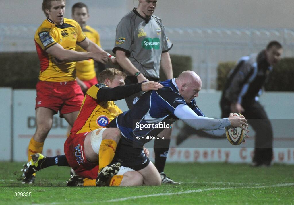 29 November 2008; Leinster's Bernard Jackman goes over for the second try despite the tackle of Newport Gwent Dragons' Jamie Ringer. Magners League, Leinster v Newport Gwent Dragons, RDS, Dublin. Picture credit: Maurice Doyle  / SPORTSFILE