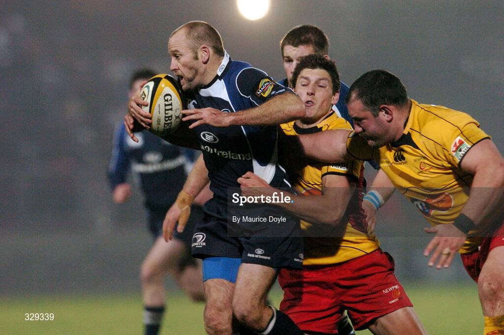 29 November 2008; Chris Whitaker, Leinster, is tackled by Phillip Dollman and Adam Black, Newport Gwent Dragons. Magners League, Leinster v Newport Gwent Dragons, RDS, Dublin. Picture credit: Maurice Doyle / SPORTSFILE