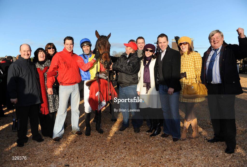 30 November 2008; Jockey Tom Doyle with members of the Irish Rover Syndicate after winning the Bar One Racing Drinmore Novice Steeplechase on Trafford Lad. Fairyhouse Winter Festival 2008, Fairyhouse Racecourse, Co. Meath. Picture credit: Brian Lawless / SPORTSFILE