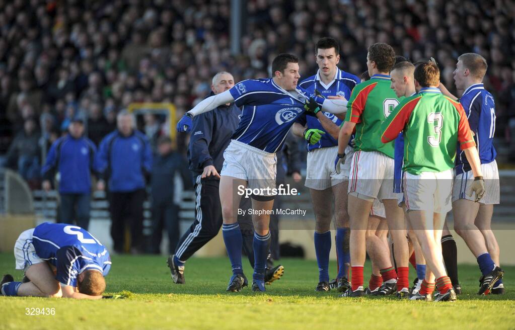 30 November 2008; David Moran, Kerins O'Rahilly's, tussles with Mid Kerry players as Declan Quill lies injured. Kerry Senior Football Championship Final Replay, Kerins O'Rahilly's v Mid Kerry, Fitzgerald Stadium, Killarney, Co. Kerry. Picture credit: Stephen McCarthy / SPORTSFILE