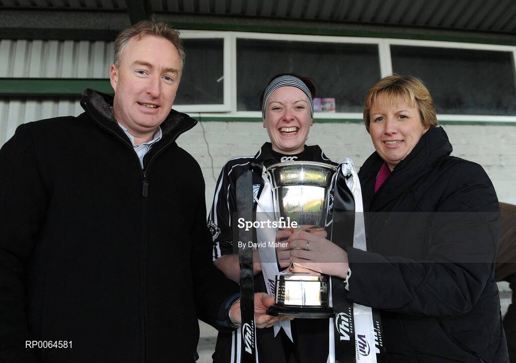 30 November 2008; Emyvale captain Sinead Mohan is presented with the VHI Healthcare All-Ireland Ladies Intermediate Club cup from Declan Moran, Director of Marketing and Product Development, Vhi Healthcare, and Geraldine Giles, President of Cumann Peil na mBan. VHI Healthcare All-Ireland Ladies Intermediate Club Football Championship Final, Emyvale, Monaghan, v Ballingeary Inchigeela, Cork, St Rynagh's, Banagher, Co. Offaly. Picture credit: David Maher / SPORTSFILE