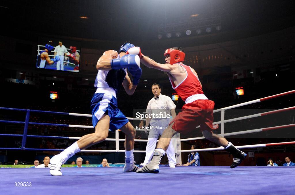 10 August 2008; John Joe Joyce, Ireland, in action against Gyula Kate, blue, Hungary, during the 'Round of 32' Light Welter, 64 kg, contest. Beijing 2008 - Games of the XXIX Olympiad, Beijing Workers Gymnasium, Olympic Green, Beijing, China. Picture credit: Ray McManus / SPORTSFILE