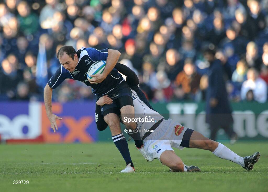 6 December 2008; Girvan Dempsey, Leinster, is tackled by Lionel Mazars, Castres Olympique. Heineken Cup, Pool 2, Round 3, Leinster v Castres Olympique, RDS, Dublin. Picture credit: Brendan Moran / SPORTSFILE