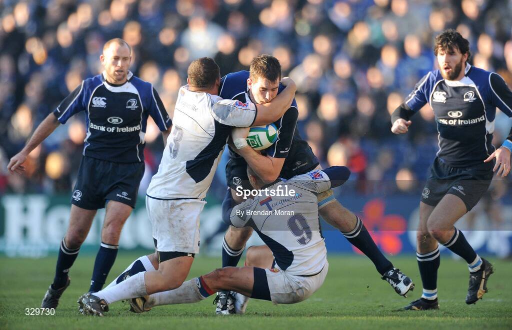 6 December 2008; Devin Toner, Leinster, is tackled by Luc Ducalcon, left, and Kevin Senio, Castres Olympique. Heineken Cup, Pool 2, Round 3, Leinster v Castres Olympique, RDS, Dublin. Picture credit: Brendan Moran / SPORTSFILE