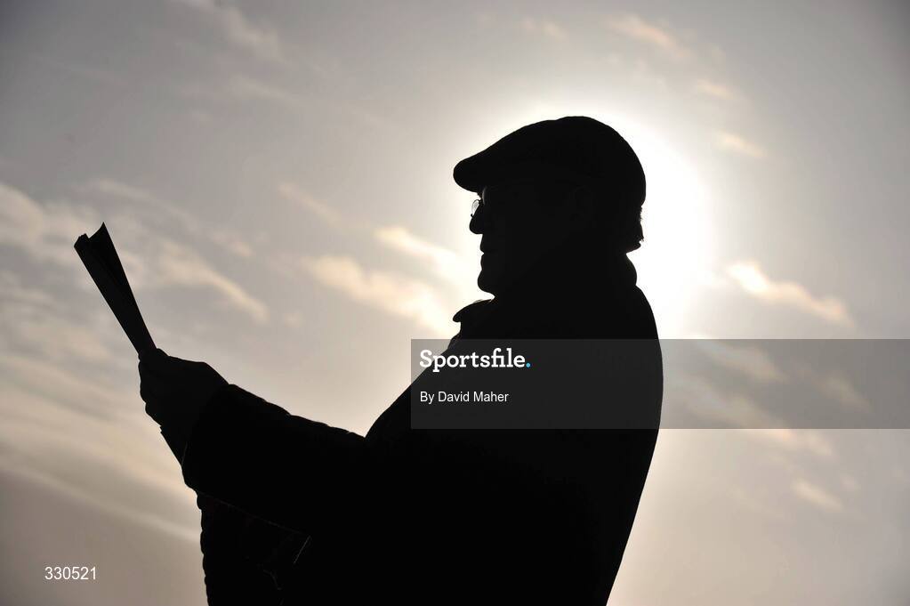 9 December 2008; A punter studies his race card before the start of racing. Punchestown Racecouse, Naas, Co. Kildare. Picture credit: David Maher / SPORTSFILE