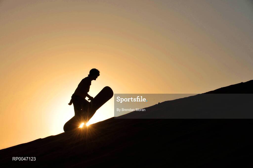 28 January 2008; A member of the 2007 All Stars team makes her way back up the slope of the sand dunes while sandboarding during a Safari Trip. O'Neills/TG4 Ladies Gaelic Football All Star Tour 2007, Dubai, United Arab Emirates. Picture credit: Brendan Moran / SPORTSFILE