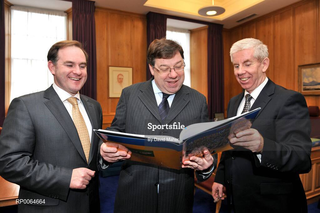 2 December 2008; Sportsfile photographer Ray McManus, right, and Alan Gilson, Commercial Director, Carroll Cusine, present a copy of A Season of Sundays 2008 to An Taoiseach Brian Cowen T.D. The 12th edition of the book is now available at all good book shops at Ä34:95. Government Buildings, Leinster House, Dublin. Picture credit: David Maher  / SPORTSFILE