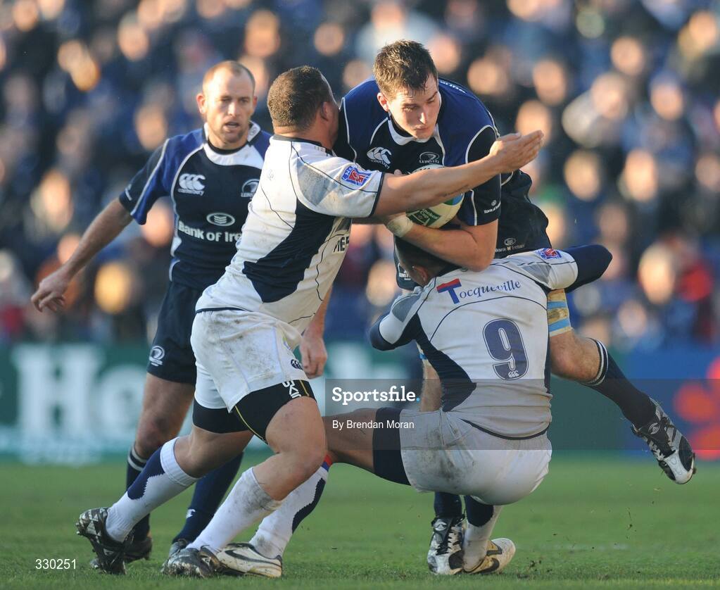 6 December 2008; Devin Toner, Leinster, is tackled by Luc Ducalcon, left, and Kevin Senio, Castres Olympique. Heineken Cup, Pool 2, Round 3, Leinster v Castres Olympique, RDS, Dublin. Picture credit: Brendan Moran / SPORTSFILE