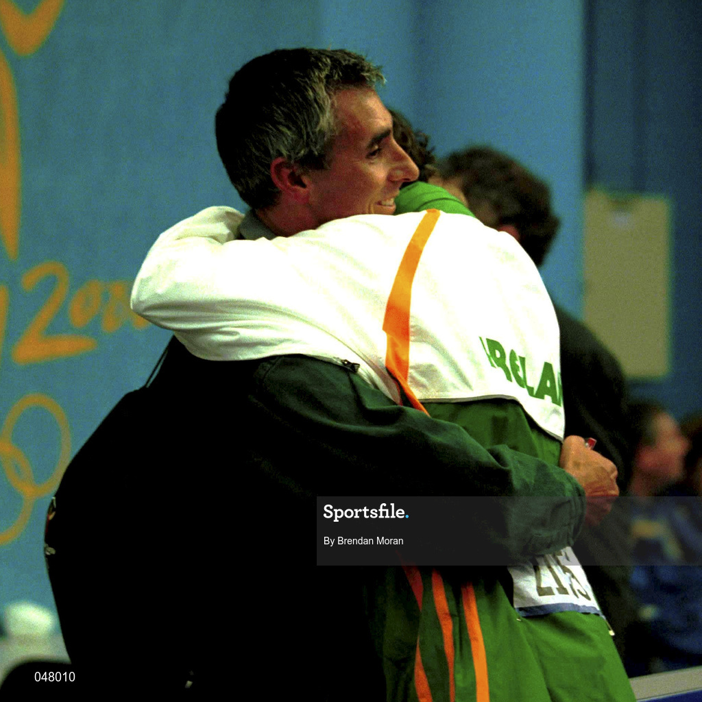 25 September 2000; Sonia O'Sullivan of Ireland embraces her partner Nick Bideau in the mixed zone after winning a silver medal in the women's 5000m race during the day 11 of the 2000 Sydney Olympics in Sydney, Australia. Photo by Brendan Moran/Sportsfile
