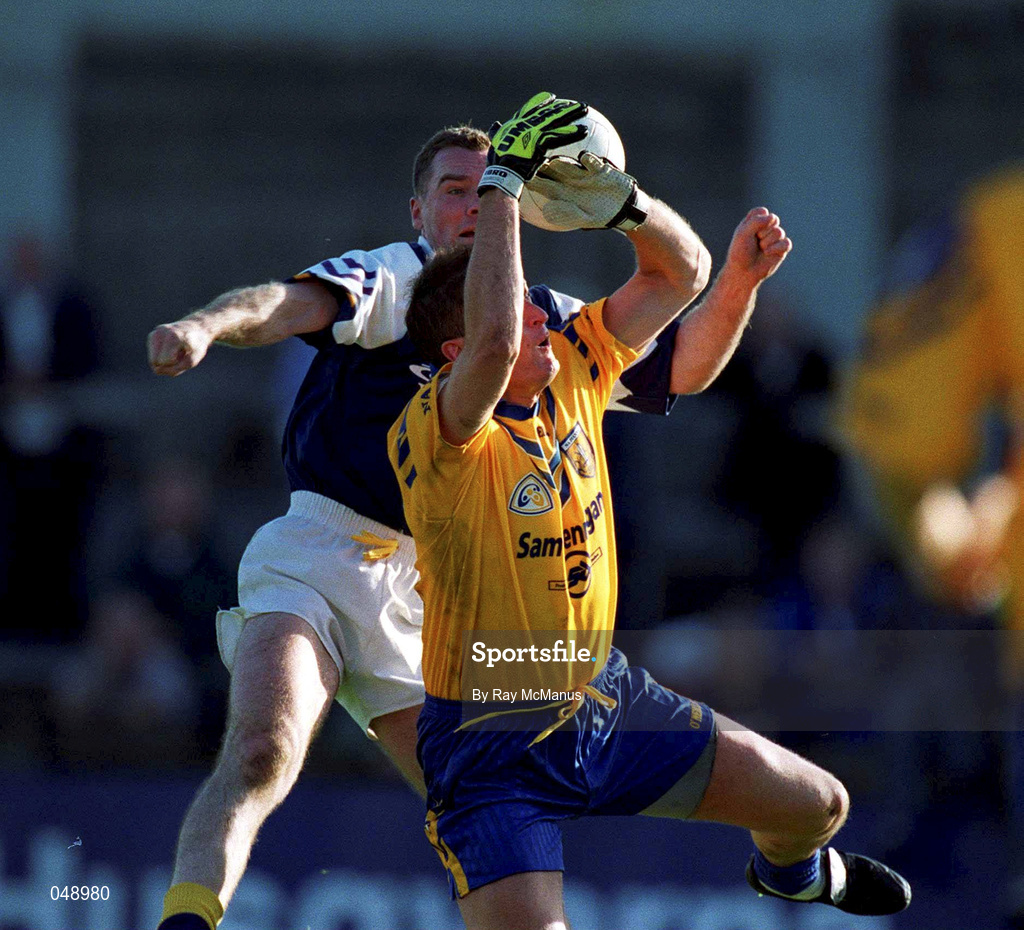 14 October 2000; Mick Galvin of Na Fianna in action against John O'Callaghan of Kilmacud Crokes during the Evening Herald Dublin Senior Football Championship Final match between Na Fianna and Kilmacud Crokes at Parnell Park in Dublin. Photo by Ray McManus/Sportsfile