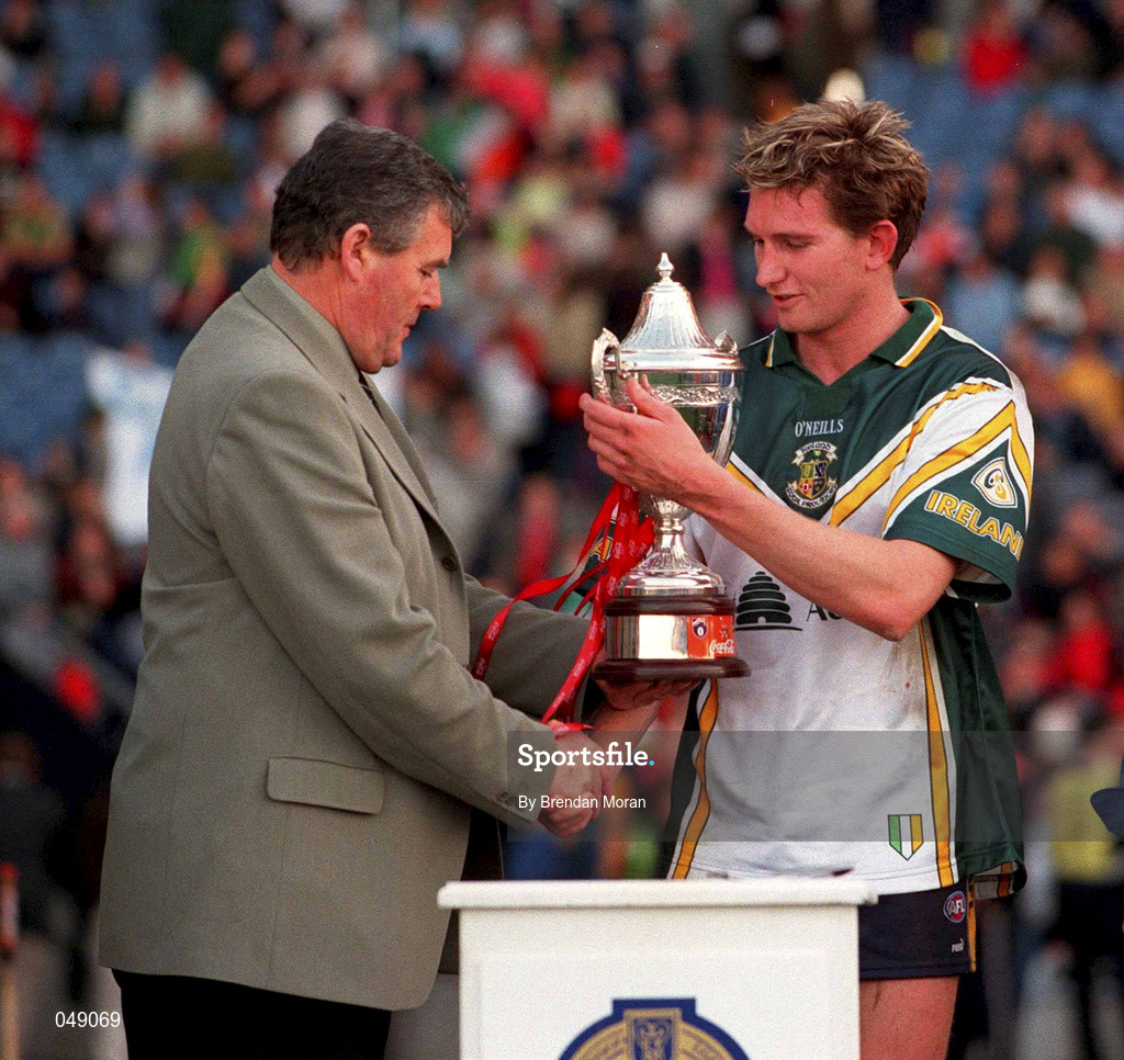15 October 2000; GAA President Sean McCague presents the trophy to Australia captain James Hird following the International Rules Series Second Test match between Ireland and Australia at Croke Park in Dublin. Photo by Brendan Moran/Sportsfile