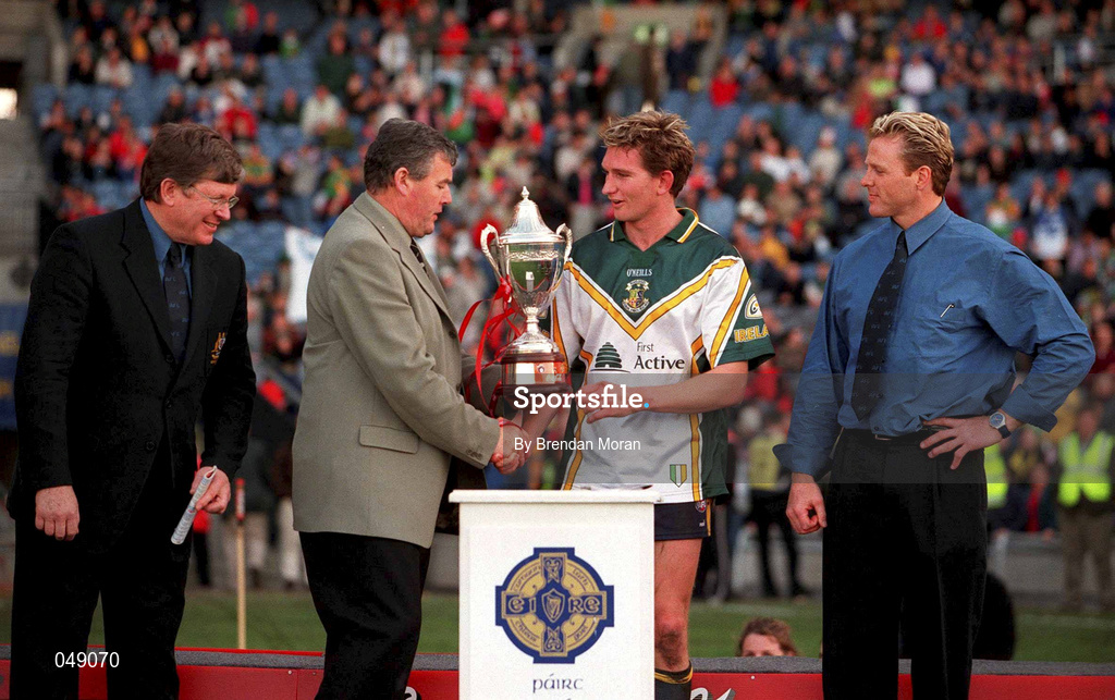 15 October 2000; GAA President Sean McCague presents the trophy to Australia captain James Hird following the International Rules Series Second Test match between Ireland and Australia at Croke Park in Dublin. Photo by Brendan Moran/Sportsfile