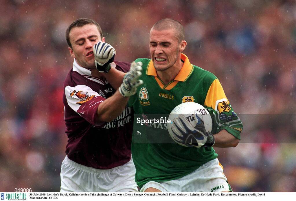 30 July 2000; Leitrim's Derek Kelleher holds off the challenge of Galway's Derek Savage. Connacht Football Final, Galway v Leitrim, Dr Hyde Park, Roscommon. Picture credit; David Maher/SPORTSFILE